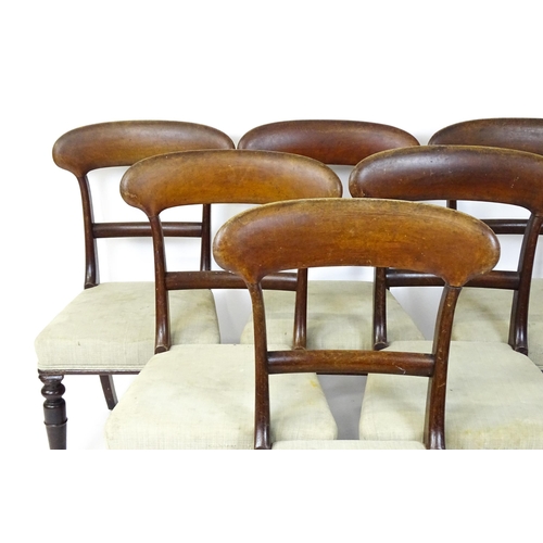 1815 - A set of six Victorian mahogany balloon back dining chairs raised on turned tapering front legs. 18