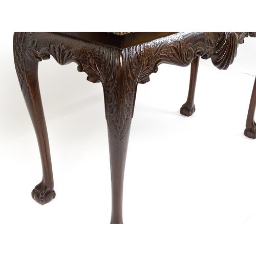 1819 - An antique Irish console table with a gadrooned top edge above a floral and shell carved apron raise... 