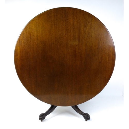 1821 - A large early 19thC Irish dining / breakfast table with a large circular top above a turned pedestal... 