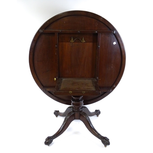 1821 - A large early 19thC Irish dining / breakfast table with a large circular top above a turned pedestal... 