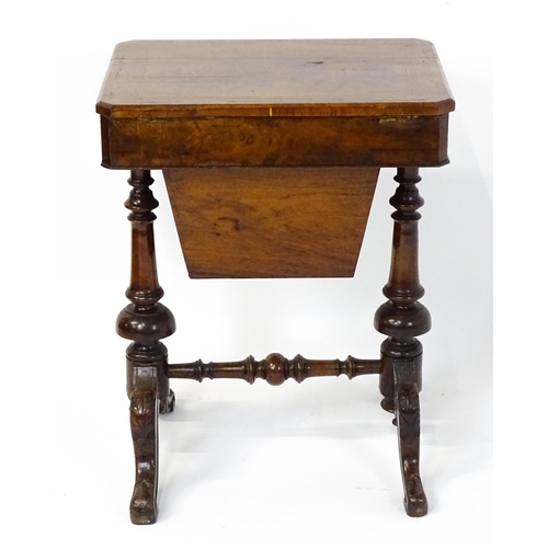 1827 - A Victorian walnut sewing table with satinwood decorative inlay, the lid opening to show fitted comp... 