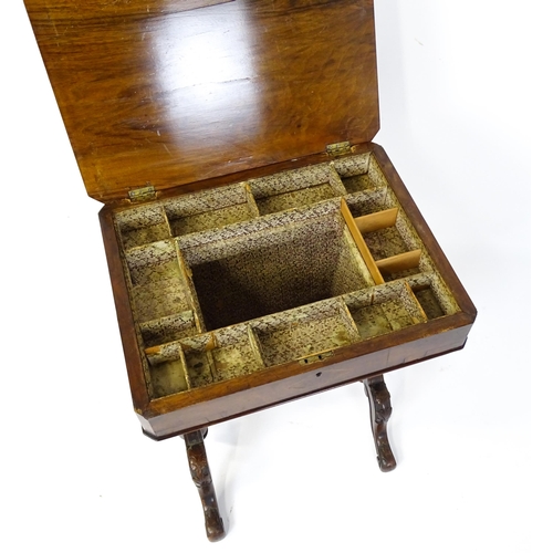 1827 - A Victorian walnut sewing table with satinwood decorative inlay, the lid opening to show fitted comp... 