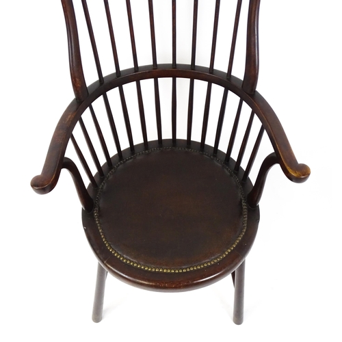 1829 - An Arts & Crafts c. 1900 Windsor chair in the manner of Liberty & Co. The chair having a bowed stick... 