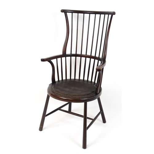 1829 - An Arts & Crafts c. 1900 Windsor chair in the manner of Liberty & Co. The chair having a bowed stick... 