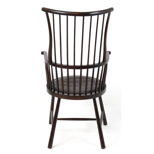 1829 - An Arts & Crafts c. 1900 Windsor chair in the manner of Liberty & Co. The chair having a bowed stick... 