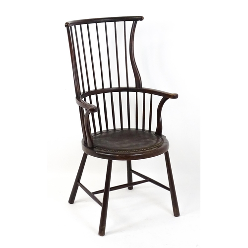 1829 - An Arts & Crafts c. 1900 Windsor chair in the manner of Liberty & Co. The chair having a bowed stick... 