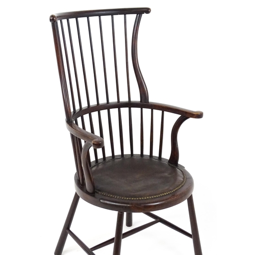 1829 - An Arts & Crafts c. 1900 Windsor chair in the manner of Liberty & Co. The chair having a bowed stick... 