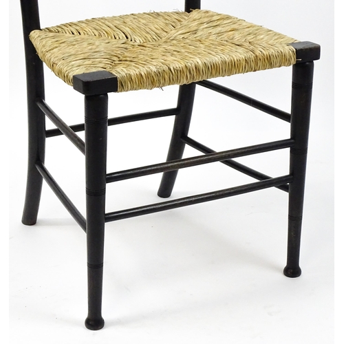 1840 - An Arts & Crafts Morris & Co designed Sussex chair with an envelope seat raised on ring turned taper... 