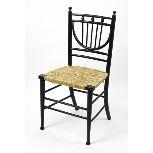 1840 - An Arts & Crafts Morris & Co designed Sussex chair with an envelope seat raised on ring turned taper... 