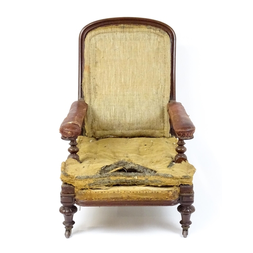 1841 - A William IV mahogany reclining armchair with leather upholstered armrests and raised on turned tape... 