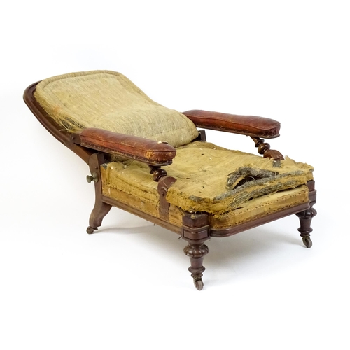 1841 - A William IV mahogany reclining armchair with leather upholstered armrests and raised on turned tape... 