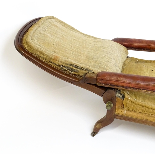 1841 - A William IV mahogany reclining armchair with leather upholstered armrests and raised on turned tape... 