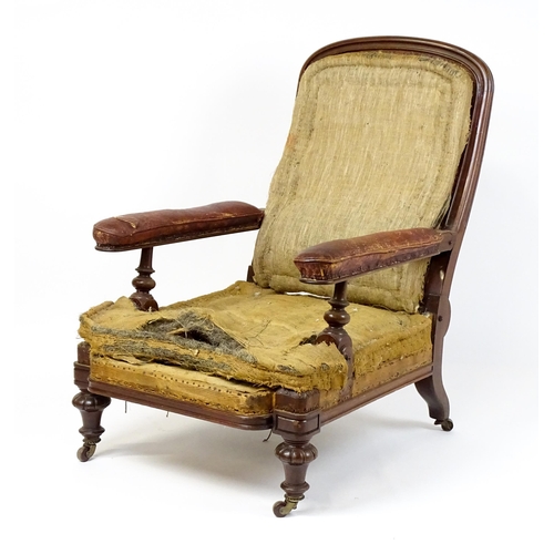 1841 - A William IV mahogany reclining armchair with leather upholstered armrests and raised on turned tape... 