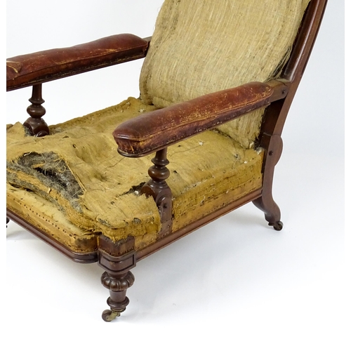 1841 - A William IV mahogany reclining armchair with leather upholstered armrests and raised on turned tape... 