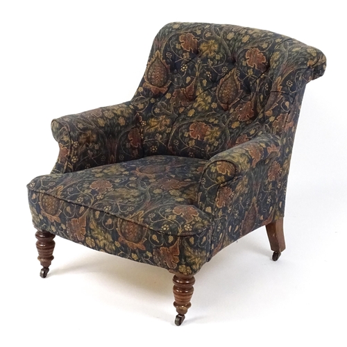 1856 - A late 19thC nursing chair with a deep buttoned backrest, scrolled armrests, sprung seat and raised ... 