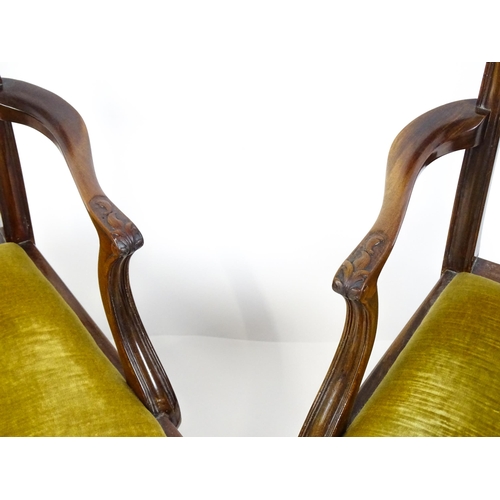 1861 - A pair of late 19thC Chippendale style open armchairs, with pierced and carved back splats above spl... 