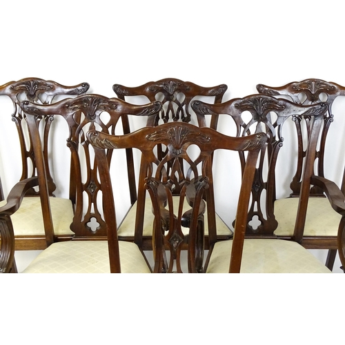 1862 - A set of 14 early / mid 20thC Chippendale style mahogany dining chairs (12+2). The chairs having car... 