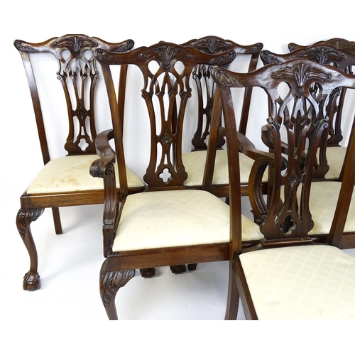 1862 - A set of 14 early / mid 20thC Chippendale style mahogany dining chairs (12+2). The chairs having car... 