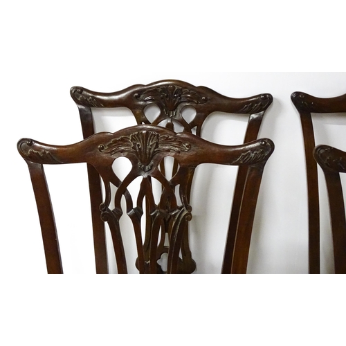 1862 - A set of 14 early / mid 20thC Chippendale style mahogany dining chairs (12+2). The chairs having car... 