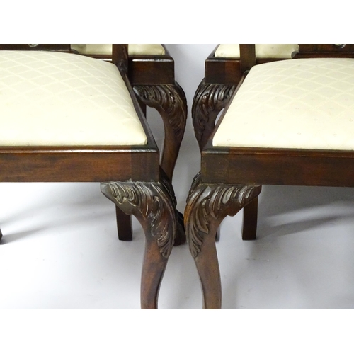 1862 - A set of 14 early / mid 20thC Chippendale style mahogany dining chairs (12+2). The chairs having car... 