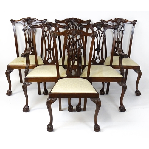 1862 - A set of 14 early / mid 20thC Chippendale style mahogany dining chairs (12+2). The chairs having car... 