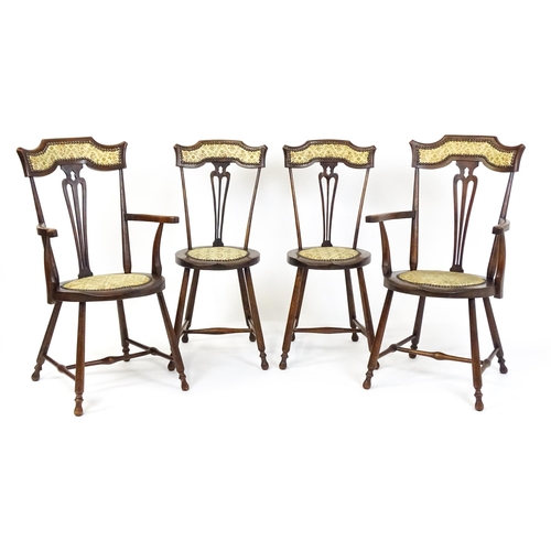 1864 - A set of four Arts & Crafts chairs with shaped and upholstered backrests above pierced back splats a... 