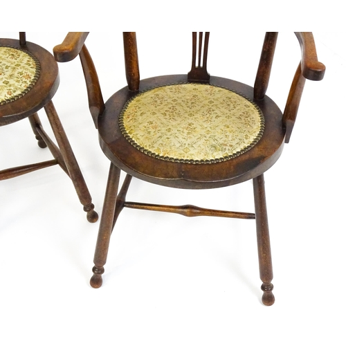 1864 - A set of four Arts & Crafts chairs with shaped and upholstered backrests above pierced back splats a... 