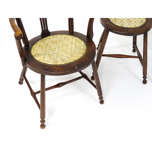 1864 - A set of four Arts & Crafts chairs with shaped and upholstered backrests above pierced back splats a... 