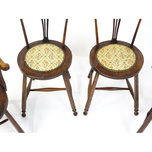 1864 - A set of four Arts & Crafts chairs with shaped and upholstered backrests above pierced back splats a... 