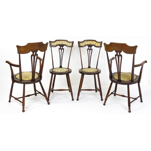 1864 - A set of four Arts & Crafts chairs with shaped and upholstered backrests above pierced back splats a... 