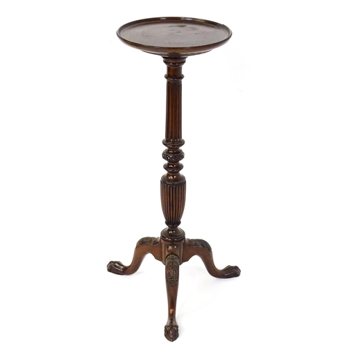 1872 - A 19thC mahogany jardinière stand with a circular top above a fluted, reeded and carved pedestal rai... 