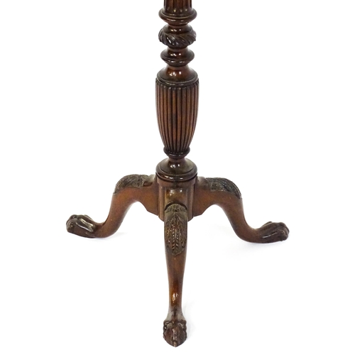 1872 - A 19thC mahogany jardinière stand with a circular top above a fluted, reeded and carved pedestal rai... 