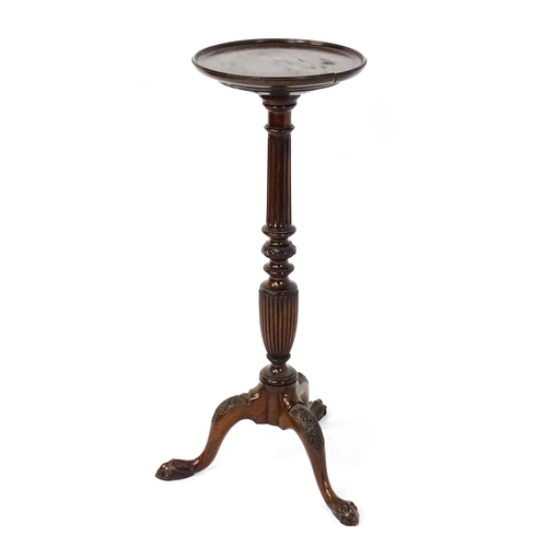 1872 - A 19thC mahogany jardinière stand with a circular top above a fluted, reeded and carved pedestal rai... 