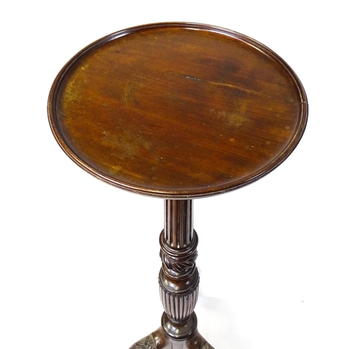 1872 - A 19thC mahogany jardinière stand with a circular top above a fluted, reeded and carved pedestal rai... 