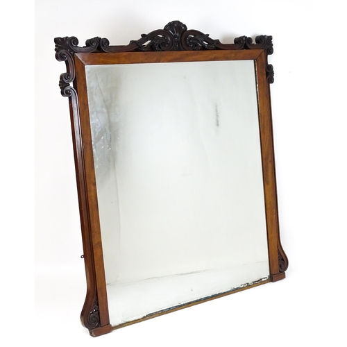 1873 - A large late 19thC mahogany over mantle mirror with a carved scrolling pediment. 60