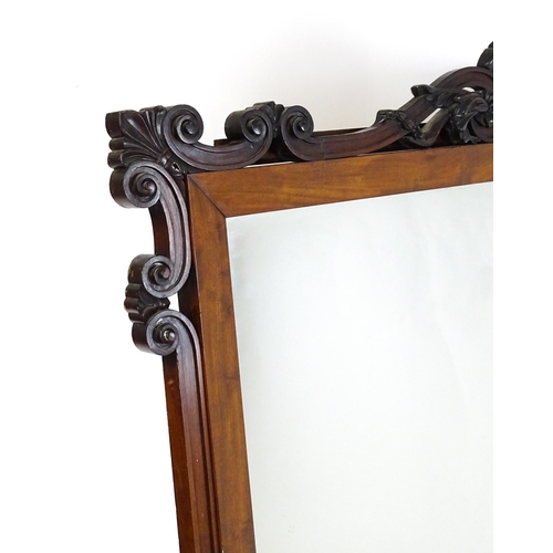 1873 - A large late 19thC mahogany over mantle mirror with a carved scrolling pediment. 60