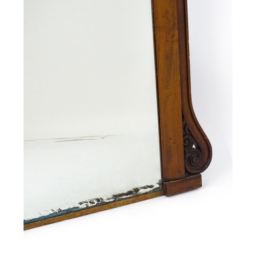 1873 - A large late 19thC mahogany over mantle mirror with a carved scrolling pediment. 60