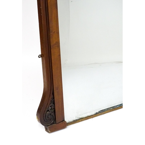 1873 - A large late 19thC mahogany over mantle mirror with a carved scrolling pediment. 60