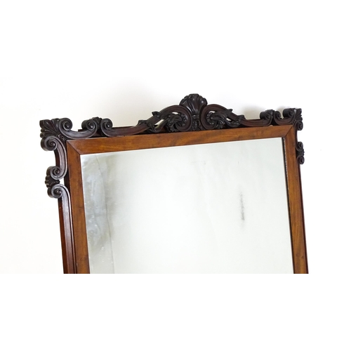 1873 - A large late 19thC mahogany over mantle mirror with a carved scrolling pediment. 60