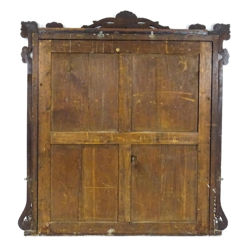 1873 - A large late 19thC mahogany over mantle mirror with a carved scrolling pediment. 60