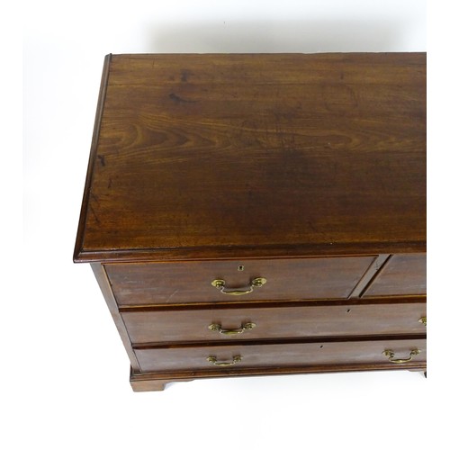 1736 - A Georgian mahogany chest of drawers with a moulded top above two short over two long drawers with s... 