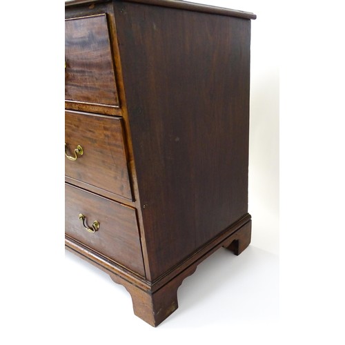 1736 - A Georgian mahogany chest of drawers with a moulded top above two short over two long drawers with s... 