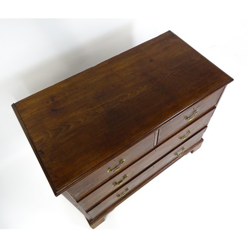 1736 - A Georgian mahogany chest of drawers with a moulded top above two short over two long drawers with s... 