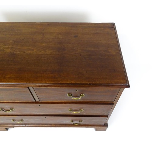 1736 - A Georgian mahogany chest of drawers with a moulded top above two short over two long drawers with s... 