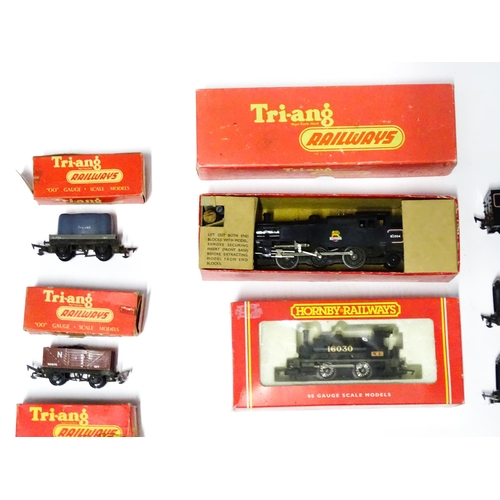 1180 - Toys - Model Train / Railway Interest : A quantity of Tri-ang OO gauge locomotives, wagons, carriage... 