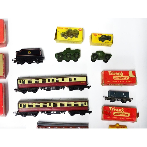 1180 - Toys - Model Train / Railway Interest : A quantity of Tri-ang OO gauge locomotives, wagons, carriage... 