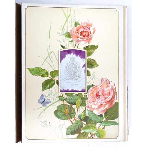 2462 - A Victorian leather covered Album des Roses photograph album by Marcus Ward & Co. containing various... 