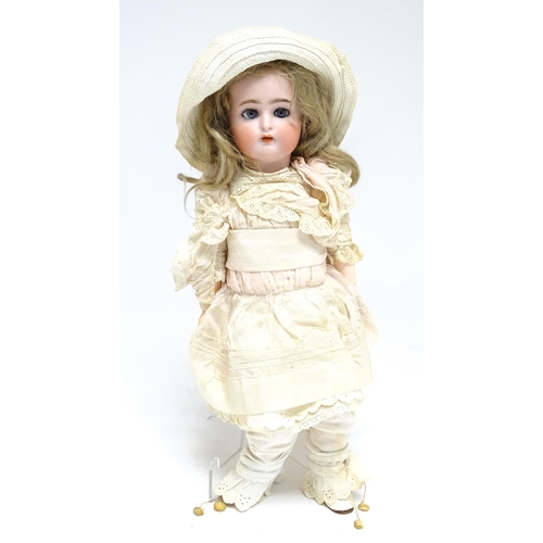 1172 - Toy: A German Kammer & Reinhardt doll with bisque head, blinking eyes, painted lips and eyebrows, wi... 