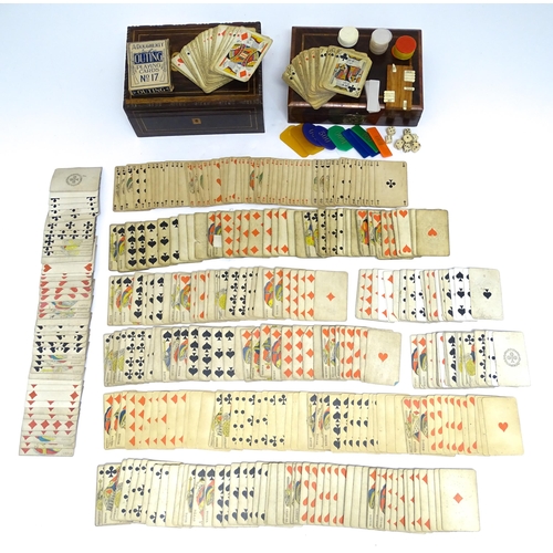 1176A - Toys: Two 20thC boxes with inlaid decoration containing assorted gaming components to include mother... 