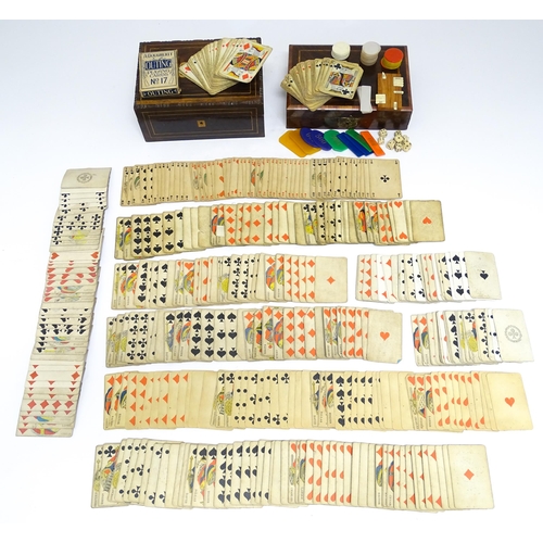 1176A - Toys: Two 20thC boxes with inlaid decoration containing assorted gaming components to include mother... 